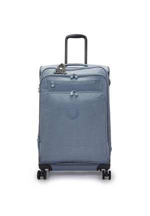 Light blue hard-shell suitcase with two front zippers, retractable handle, black wheels, and a black character charm attached to the zipper.