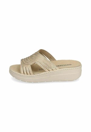 Sandalo beige con zeppa, cinturini decorativi traforati e soletta imbottita su sfondo bianco.