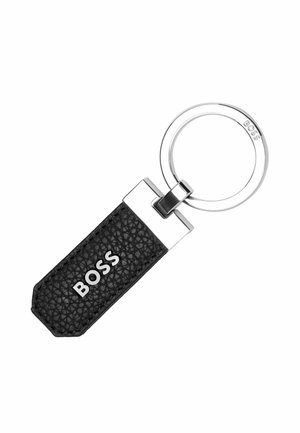 Porte-clés en cuir noir avec une finition texturée, quincaillerie en tonalité argentée, et une étiquette rectangulaire présentant le logo "BOSS" en relief.