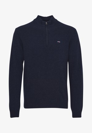 Pulover bleumarin cu fermoar la gât, cu manșete și tiv cu model texturat. Are un mic logo tricolor pe piept. Textură moale din tricot.