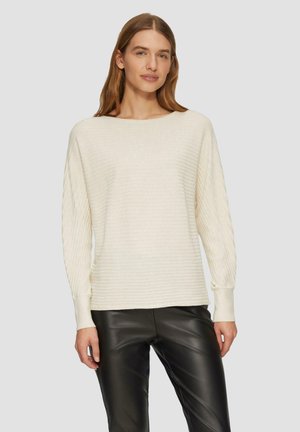 Cream ribbed knit sweater with a wide neckline and long, slightly puffed sleeves, paired with black leather pants. Smooth texture.