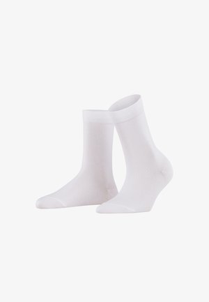 Białe skarpetki bawełniane o gładkiej fakturze, z prążkowanym mankietem i bezszwowym palcem dla wygody. Odpowiednie do noszenia na co dzień lub na formalne okazje.