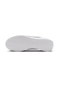 White sneaker sole with a textured rubber surface featuring a herringbone pattern, branded with a logo near the heel.