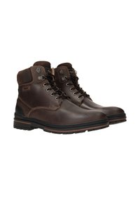 Bruine leren boots met een hoog enkelontwerp, vetersluiting en metalen hardware. Kenmerkt zich door contrasterende stiksels en een duurzame rubberen zool.