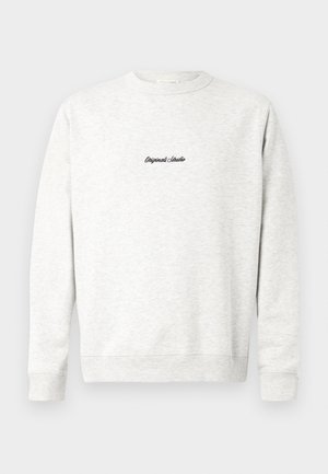 Helehall sweatshirt, mis on valmistatud pehmest materjalist, kusjuures esiküljel on väike must "Originals Studio" logo ja ribatud varrukad.