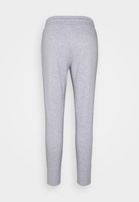 Ljusgrå sweatpants med elastisk midja och muddar vid anklarna, visade bakifrån mot en helt vit bakgrund.
