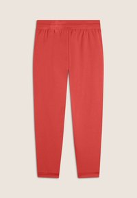 Leggings rojos de algodón con una cinturilla elástica y piernas ajustadas, que presentan una textura suave y sin patrones ni elementos visibles.