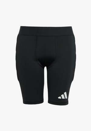 Schwarze sportliche Kompressionsshorts mit tailliertem Schnitt, elastischem Bund und einem weißen Adidas-Logo auf der unteren linken Seite. Glatte Textur.