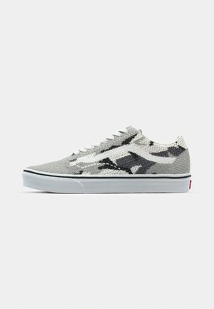 Gray and black patterned sneaker with a textured fabric upper, white laces, and rubber sole featuring a black stripe. Red logo on heel.