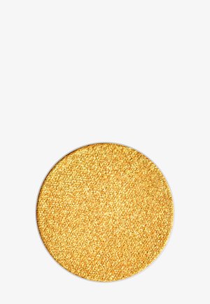 Polvere di glitter dorata in un contenitore circolare. Texture fine con particelle riflettenti, che creano un aspetto scintillante.