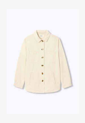 Veste-chemise blanc cassé à boutons, manches longues, deux poches poitrine, deux poches latérales basses, et boutons en écailles de tortue à l'avant.