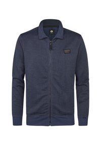 Jachetă cu fermoar de marină, realizată dintr-un material texturat. Are un guler înalt, manșete ribbed și un mic patch cu logo pe piept.