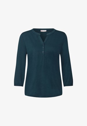 Top bleu-vert à manches longues avec un col en V et une patte de boutonnage à quatre boutons, doté de manches 3/4 et d'une coupe décontractée. Tissu doux et texturé.