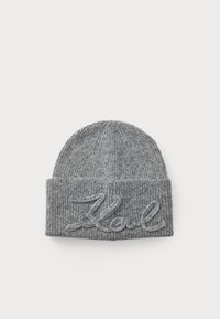 Gray knit beanie featuring a ribbed texture and a folded cuff. Embroidered word "Koul" in a contrasting color at the front.