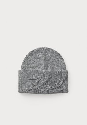Gray knit beanie featuring a ribbed texture and a folded cuff. Embroidered word "Koul" in a contrasting color at the front.