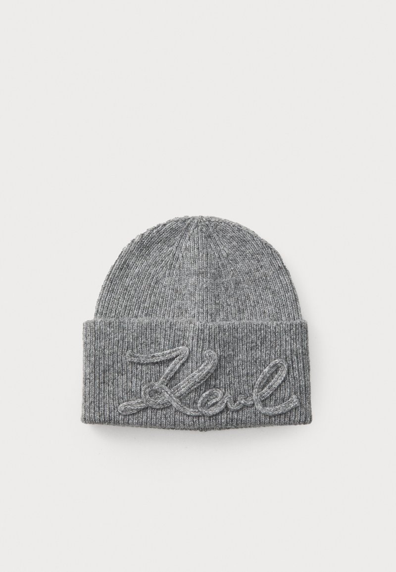 Gray knit beanie featuring a ribbed texture and a folded cuff. Embroidered word "Koul" in a contrasting color at the front.
