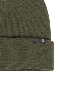 Olive green knit beanie with a folded cuff and a small black label featuring a logo stitched on the side, textured fabric.