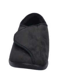 Pantofole nere in morbido suede con forma arrotondata, caratterizzate da un design incrociato laterale e una suola in gomma per una buona presa. Foderate in tessuto soffice.
