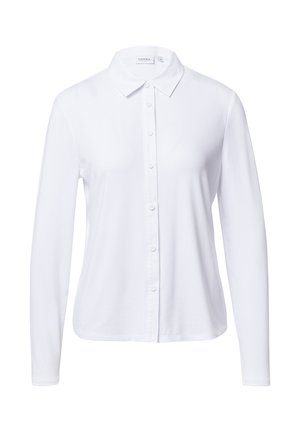 Camicia bianca a maniche lunghe con colletto, chiusura frontale con bottoni, texture liscia, vestibilità su misura e orlo arrotondato. Realizzata in tessuto leggero.