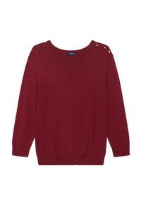 Röd stickad tröja med rundad halsringning, långa ärmar och dekorativa guldknappar på vänster axel. Mjuk textur, avslappnad passform.