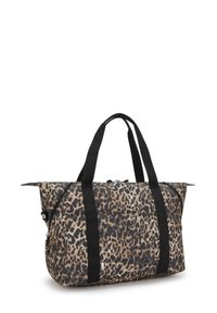 Leopard print tote bag features black straps, a zip closure, and a durable fabric material. It has a spacious design with side pockets.