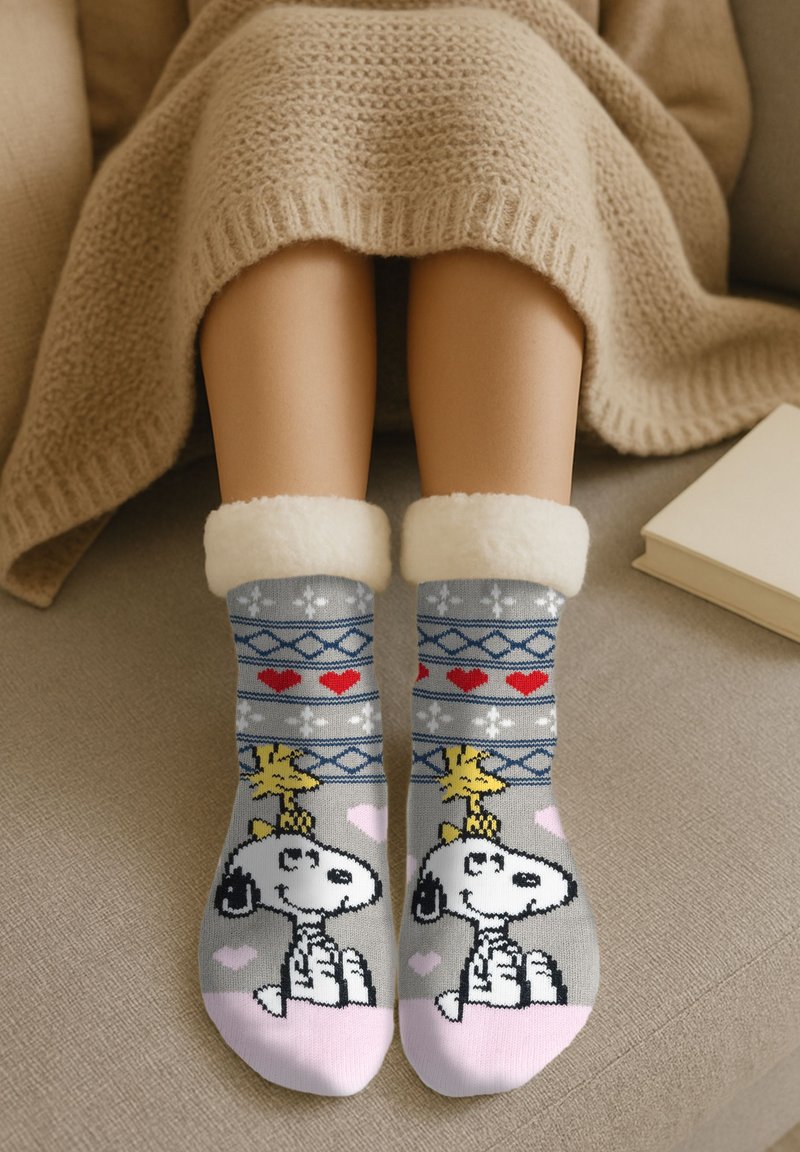 Gray and pink socks with a cartoon dog design, plush white cuffs, geometric patterns, and hearts in red and blue knitted fabric.