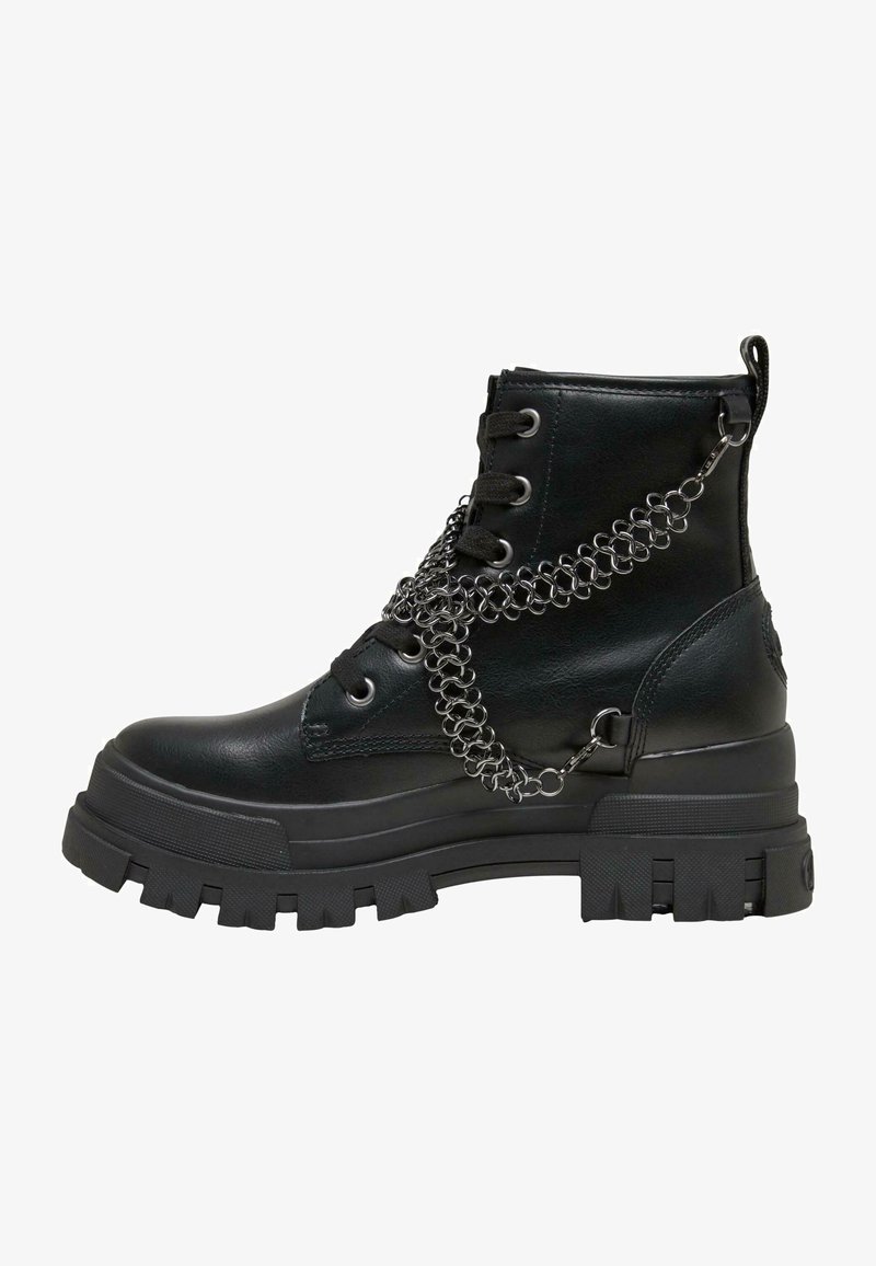 Black leather ankle boot with a chunky platform sole, featuring a chain accent across the upper and round laces.