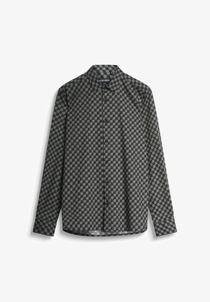 Camisa de manga larga en tonos oscuros con un patrón geométrico de círculos claros y oscuros alternos, confeccionada en una tela suave y con un cuello clásico.