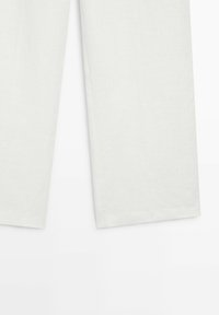 Lower portion of white straight-leg pants with wide hems, shown against a plain white background.
