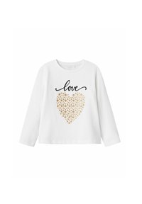 Camisa de manga larga blanca que presenta un texto en negro con script que dice "amor" y un diseño de corazón con puntos dorados. Tejido de algodón suave con un ajuste clásico.