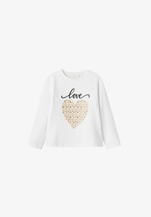 Camisa de manga larga blanca que presenta un texto en negro con script que dice "amor" y un diseño de corazón con puntos dorados. Tejido de algodón suave con un ajuste clásico.