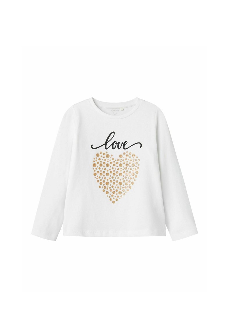 Camisa de manga larga blanca que presenta un texto en negro con script que dice "amor" y un diseño de corazón con puntos dorados. Tejido de algodón suave con un ajuste clásico.