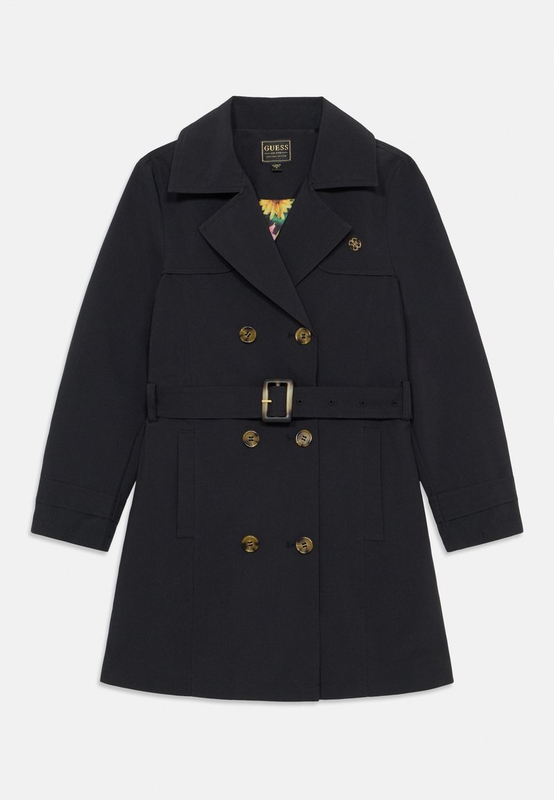 Manteau de marine en tissu résistant, croisé avec des boutons dorés, taille ceinturée et large col. Doublure florale visible.
