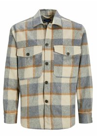 Camicia in lana a scacchi nei colori crema, grigio e ruggine, con chiusura a bottoni, due tasche sul petto e colletto classico. Tessuto morbido, vestibilità rilassata.