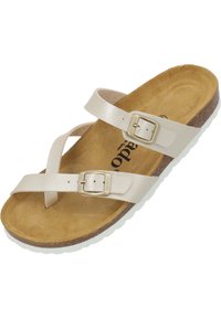 Ljusbeige sandaler med justerbara remmar, guldfärgade spännen, korkfotstöd och en strukturerad sula för grepp.
