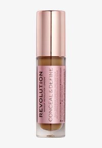 Correcteur liquide dans un flacon en verre transparent avec une étiquette rose, des accents dorés et un bouchon en or rose brillant. Le texte comprend le nom du produit et des détails d'utilisation.