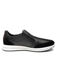 Black leather slip-on sneaker with white sole and textured grip, featuring suede accents on toe and heel.