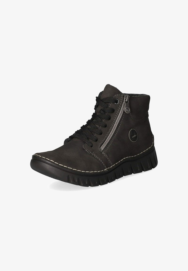 Bottine noire à cheville avec semelle épaisse en caoutchouc, fermeture éclair latérale, lacets noirs, coutures blanches et logo rond sur le côté extérieur près du talon.