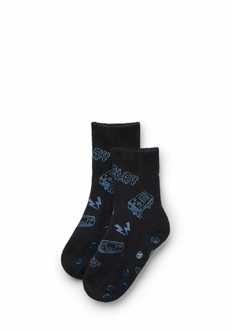 Black crew socks featuring blue graphic designs of a cassette tape and lightning bolts, with a smooth texture and contrasting polka dot accents.
