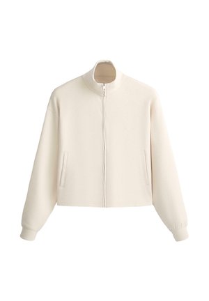 Jachetă crem cu fermoar, guler înalt, mâneci lungi, manșete elastice și două buzunare verticale în față.