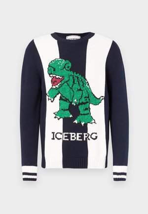 Tmavě modrý a bílý pruhovaný svetr se zelenou grafiku řvoucího dinosaura a nápisem "ICEBERG" vpředu, žebrované manžety s bílými pruhy.