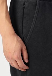 Hollister Co. Relaxed Fleece Joggers - Tracksuit bottoms - black beauty