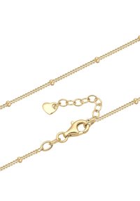 Goldfarbener Kettenarmreifen mit kleinen sphärischen Akzenten und einem herzförmigen Anhänger. Enthält einen stabilen Karabinerverschluss für einen sicheren Halt.