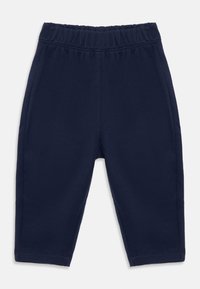 Mørkeblå fleece barnebukser med elastisk midjebånd og sidelommer på hvit bakgrunn.