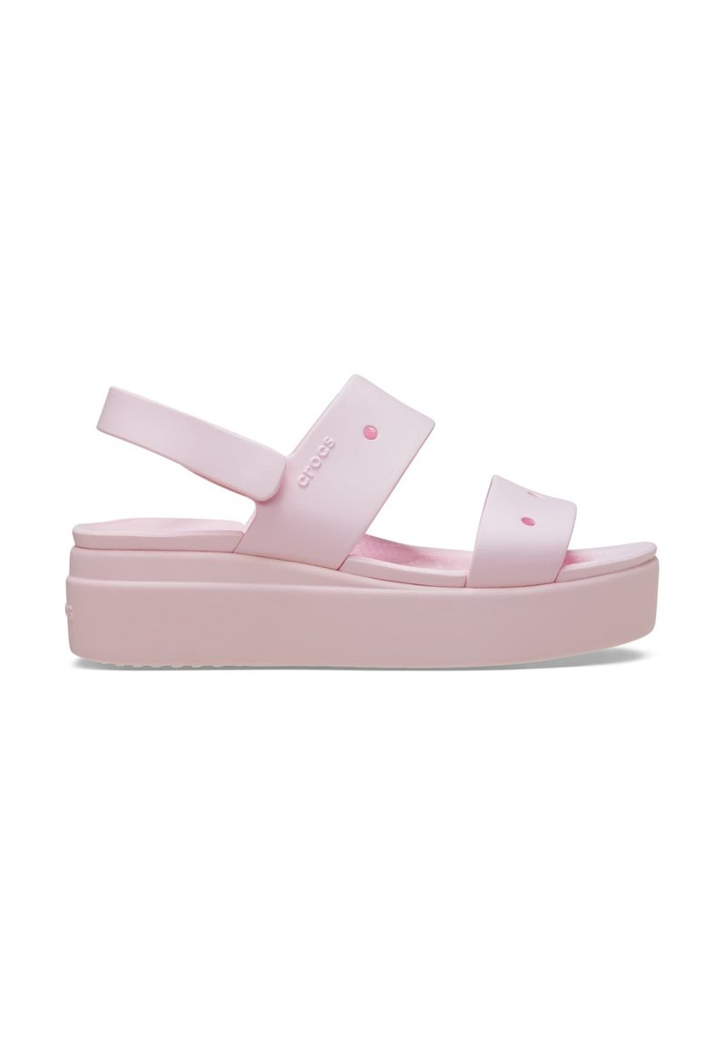 Pink platform sandals made of synthetic material with wide straps and a contoured footbed. Features rounded accents and a textured sole.