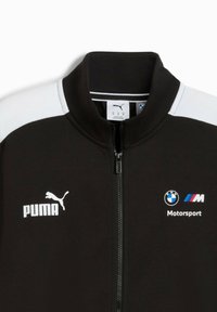 Sort zip-up jakke med hvide skulderpaneler og logoer for Puma og BMW Motorsport.