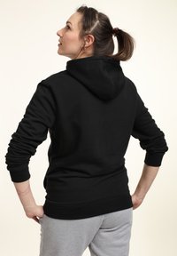 Disney NIGHTMARE BEFORE CHRISTMAS NBC TEAM STACKED EYES - Jersey con capucha - black