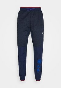 Marinefarbene Sportpants mit strukturiertem oberen Bereich, einfarbigen unteren Teilen, verstellbarem Kordelzugbund und blauen grafischen Akzenten am unteren Bein.
