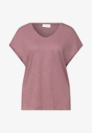 Haut ample à manches courtes mauve avec un col V et un tissu subtilement texturé, étiqueté « Street One Studio » au niveau du col.