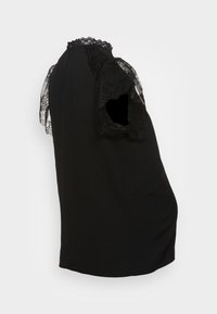 Haut noir avec manches courtes ornées de dentelle, encolure ronde et coupe décontractée. Confectionné en tissu lisse et léger.